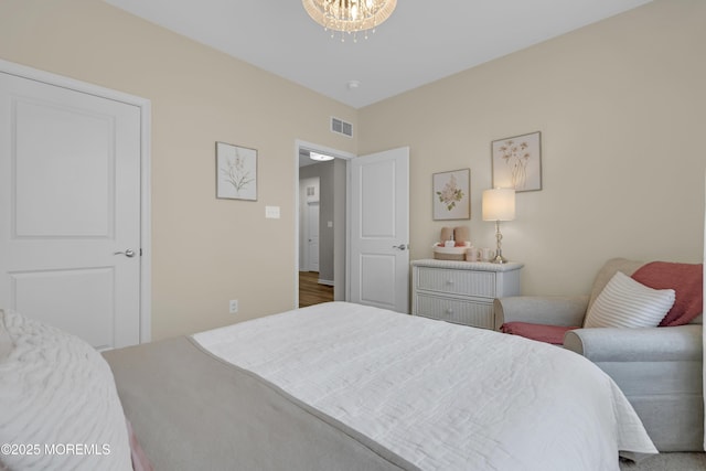 bedroom featuring an inviting chandelier