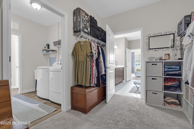 interior space featuring light carpet and washer and dryer