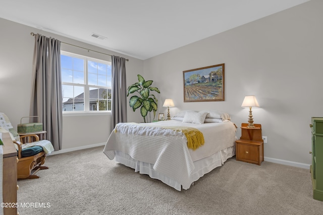 bedroom featuring light carpet