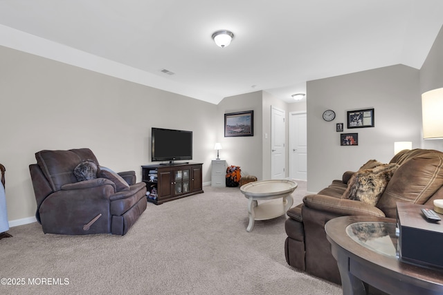 carpeted living room with lofted ceiling