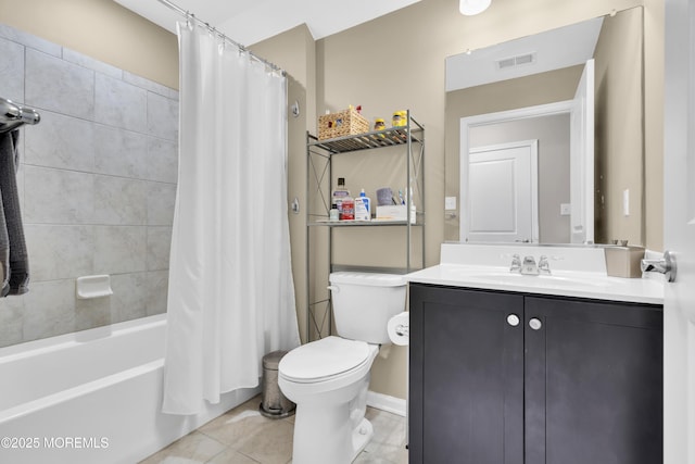 full bathroom featuring tile patterned floors, vanity, toilet, and shower / bath combo with shower curtain