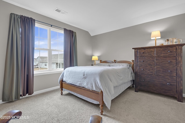 carpeted bedroom featuring lofted ceiling