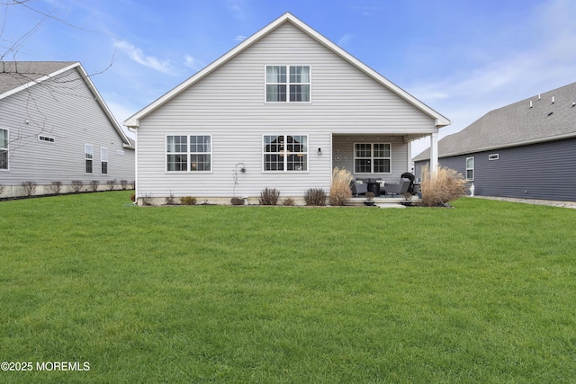 rear view of property featuring a yard