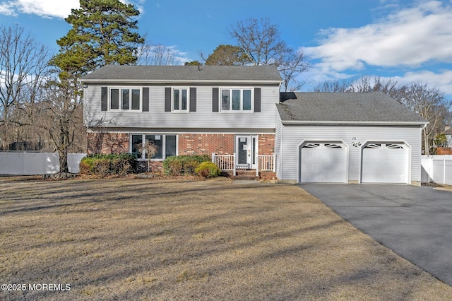 front facade featuring a garage and a front yard