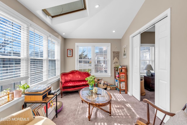 living area with lofted ceiling and carpet