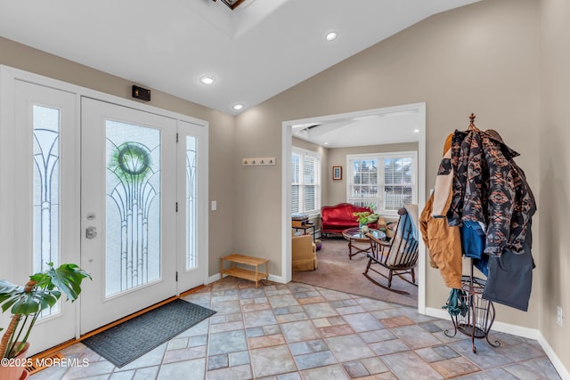 entrance foyer featuring vaulted ceiling