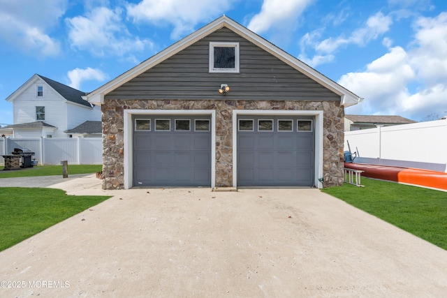 garage featuring a yard