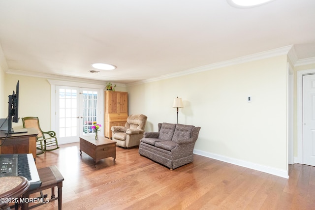 living room featuring crown molding and hardwood / wood-style flooring