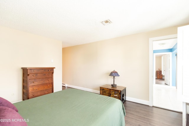 bedroom featuring dark hardwood / wood-style floors