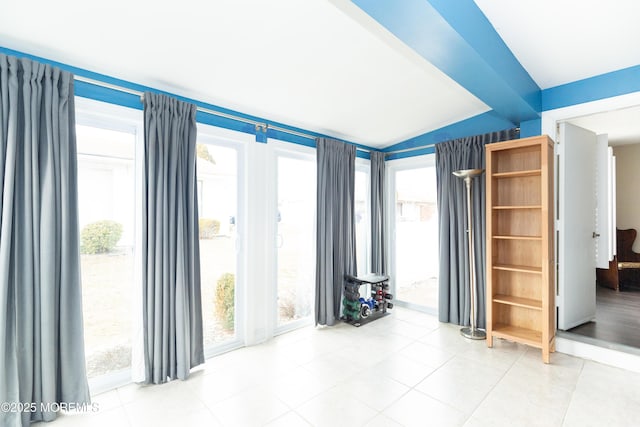 interior space with lofted ceiling with beams