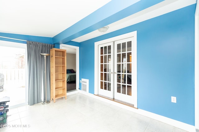 empty room featuring french doors