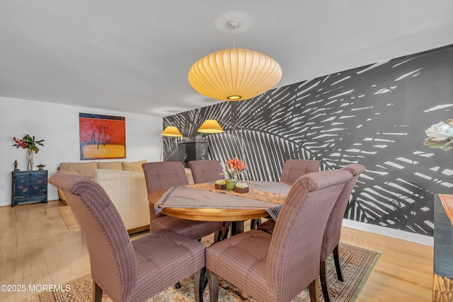 dining room with wood-type flooring