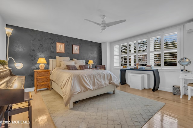 bedroom featuring ceiling fan and light wood-type flooring