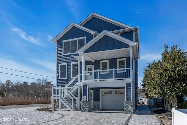 view of front of house with a garage and covered porch