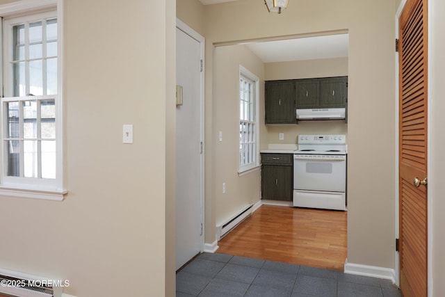 kitchen with tile patterned flooring, a baseboard heating unit, and white electric range oven