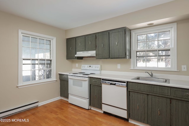 kitchen with white appliances, a baseboard radiator, sink, and light wood-type flooring