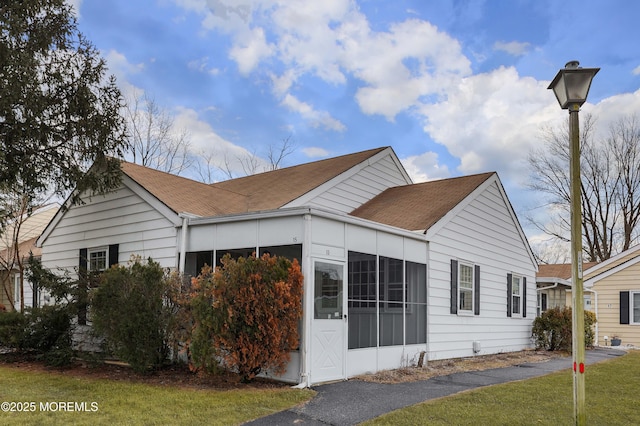 view of home's exterior featuring a lawn