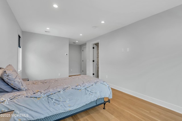 bedroom featuring hardwood / wood-style floors