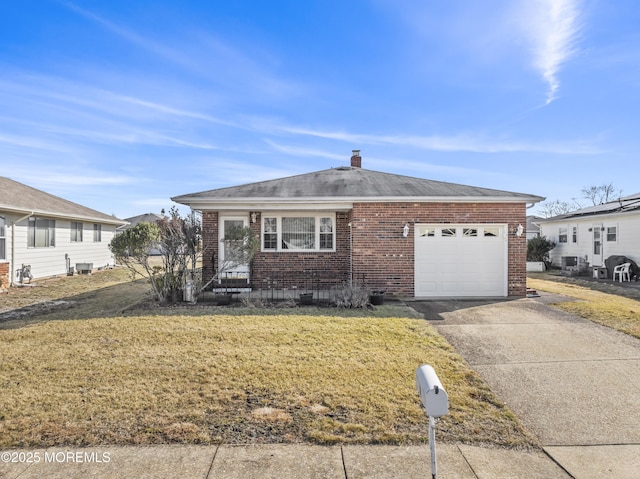 view of front of house featuring a garage and a front yard