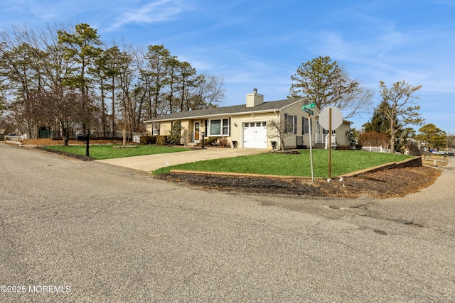 ranch-style home with a front yard and a garage