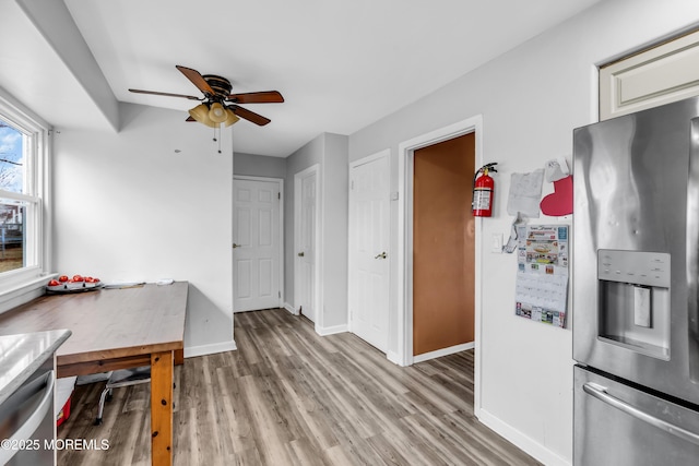 interior space featuring light hardwood / wood-style flooring and ceiling fan