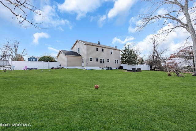 back of property featuring a lawn