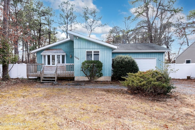 view of front of home featuring a garage and a deck