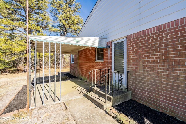 view of patio / terrace featuring driveway and an attached carport