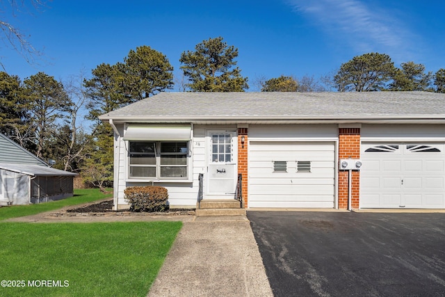 view of front of home featuring aphalt driveway, brick siding, an attached garage, and roof with shingles