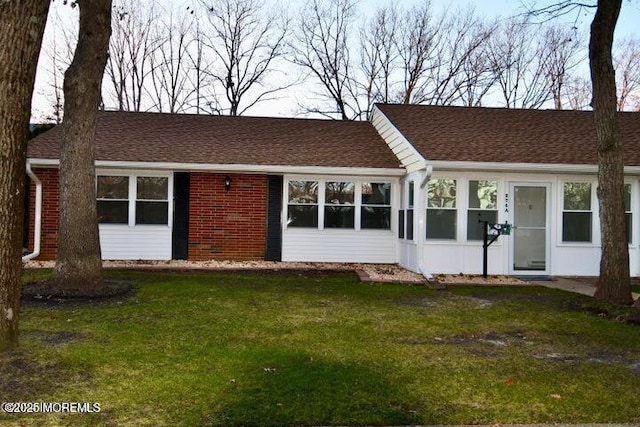 view of front of home with a front lawn