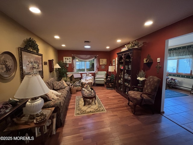 living room featuring plenty of natural light and hardwood / wood-style floors