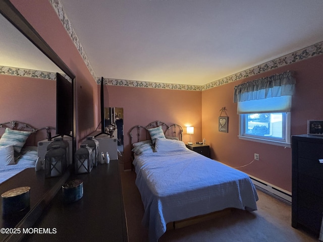 bedroom with a baseboard heating unit