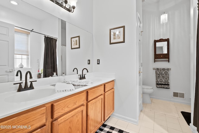 full bathroom with toilet, tile patterned flooring, visible vents, and a sink