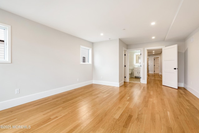 unfurnished room featuring recessed lighting, baseboards, and light wood finished floors