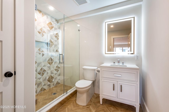 bathroom with visible vents, toilet, a shower stall, and vanity