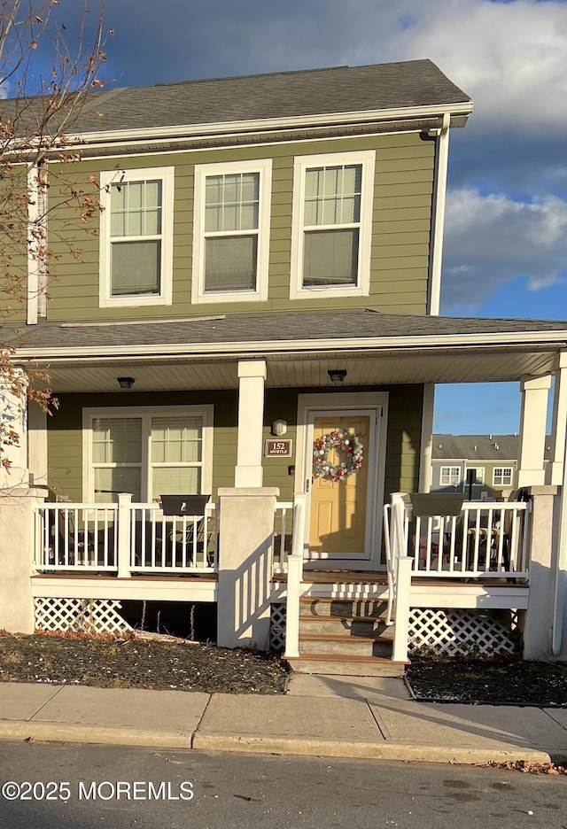 view of front of property featuring covered porch