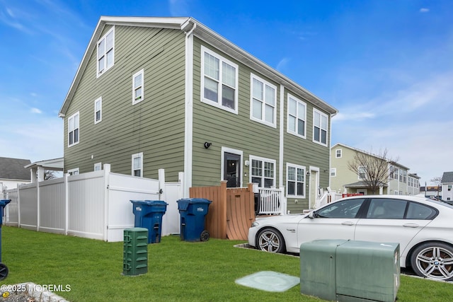 view of property exterior with a yard