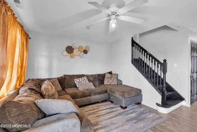 living room with ceiling fan and hardwood / wood-style floors