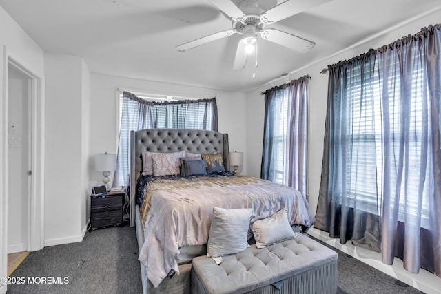 bedroom with ceiling fan and carpet