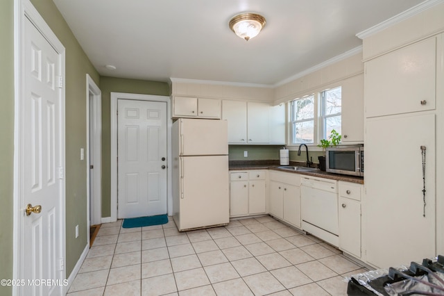 kitchen featuring sink, light tile patterned floors, white cabinets, and white appliances