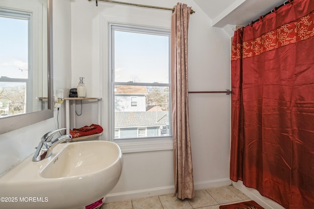 bathroom featuring tile patterned flooring, sink, and plenty of natural light