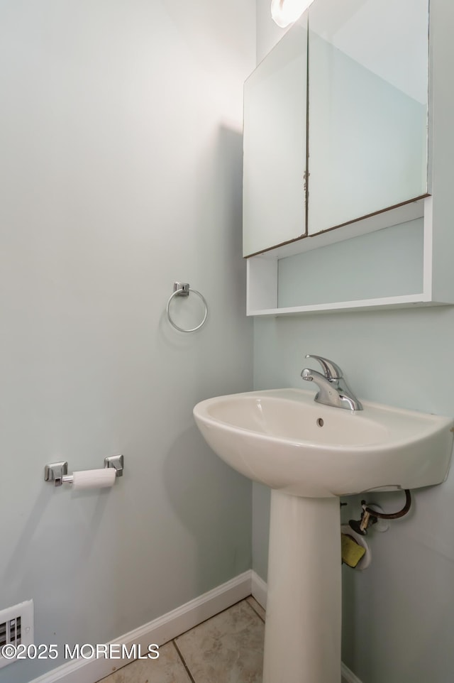 bathroom with tile patterned floors and sink