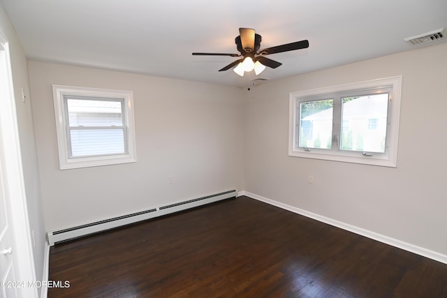 spare room featuring a baseboard radiator, dark hardwood / wood-style floors, and ceiling fan