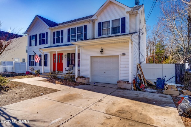 view of front of house with a garage and a porch