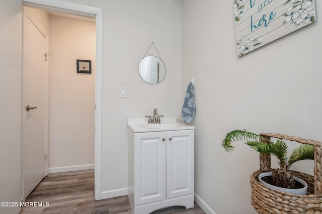 bathroom featuring vanity and hardwood / wood-style floors