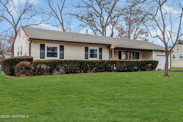 single story home with a garage and a front lawn