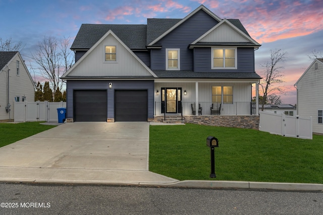 view of front of house featuring covered porch and a lawn