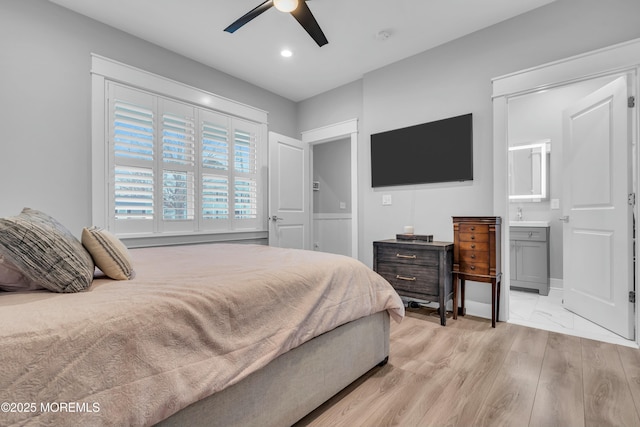 bedroom with ceiling fan and light wood-type flooring