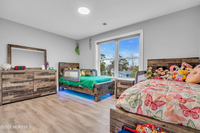 bedroom featuring light wood-type flooring