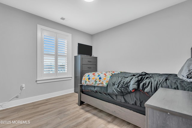 bedroom featuring hardwood / wood-style floors